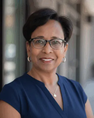 Elaine Wallace, licensed professional counselor, smiling outdoors